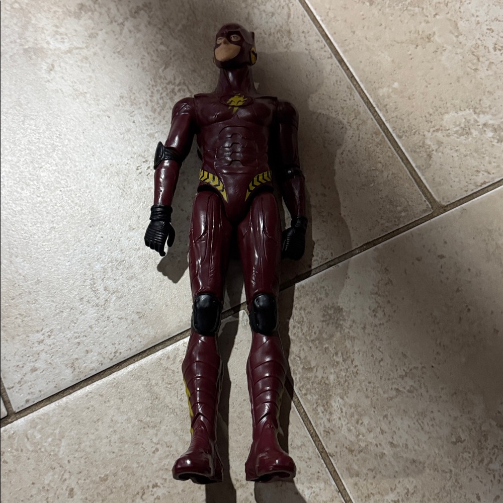 Red and Yellow Action Figure